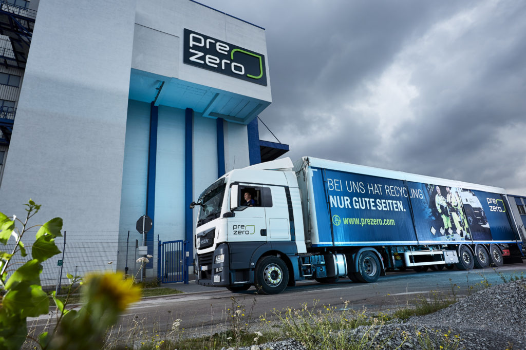 Truck on the recycling company premises taking bales for transport