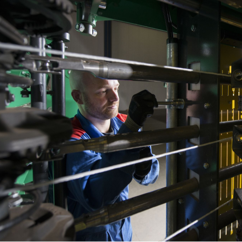 Bollegraaf engineer is working on the baler